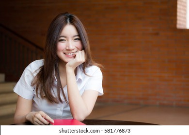 Portrait Of Thai Adult Student University Uniform Beautiful Girl Relax And Smile