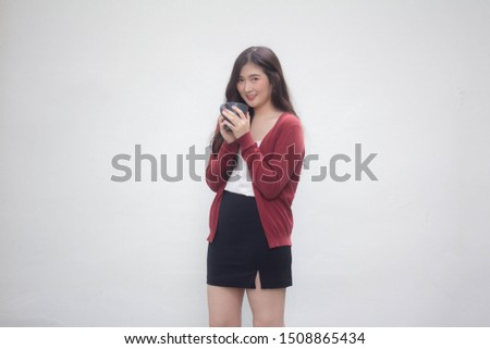 Portrait of thai adult working women size xl white shirt  drinking coffee