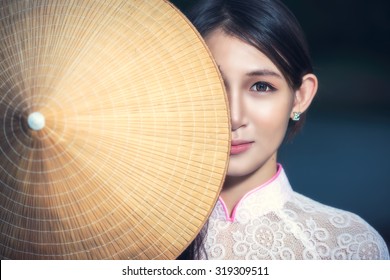 Portrait of Thai girls with Ao Dai, Vietnam traditional dress, Ao dai is famous traditional costume for woman in VIetnam. - Powered by Shutterstock