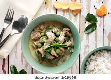 portrait of thai green curry served with rice