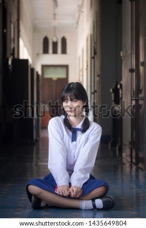 Portrait of thai high school student uniform teen beautiful girl happy and relax