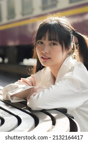 Portrait Of Thai Japan Adult Beautiful Girl White Shirt Blue Jeans Relax Time, Train Station Fashion