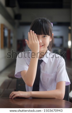 Portrait of thai Junior high school student uniform teen beautiful girl happy and relax