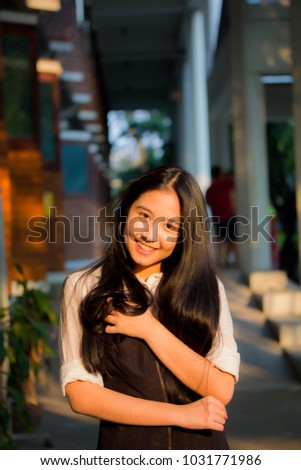 Portrait of thai teen beautiful girl happy and relax.