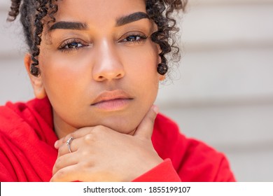 Portrait Of A Thoughtful Black Mixed Race Biracial African American Female Young Woman Girl Teenager Teen Outside