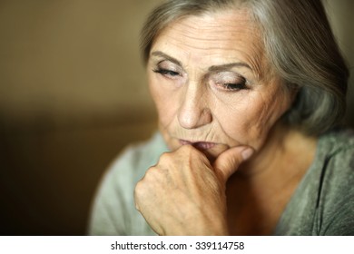 Portrait Of A Thoughtful Sad Elderly Woman