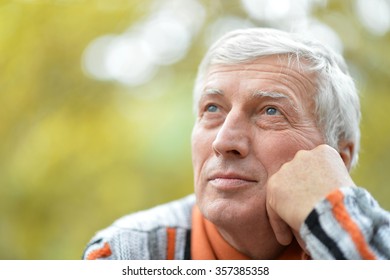 Portrait of thoughtful senior man  in  park - Powered by Shutterstock