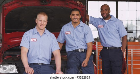 Portrait Of Three Auto Shop Mechanics