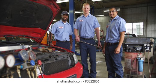 Portrait Of Three Auto Shop Mechanics