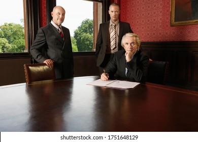 Portrait Of Three Businessmen In Boardroom