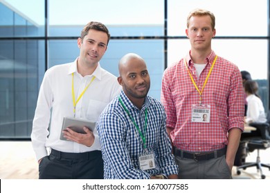 Portrait Of Three Casually Dressed Businessmen In Office