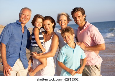 Portrait Of Three Generation Family On Beach Holiday