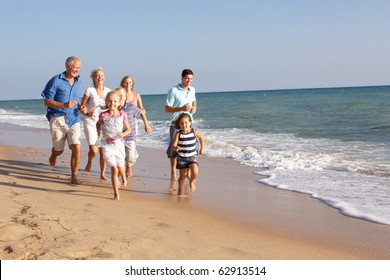 Portrait Of Three Generation Family On Beach Holiday