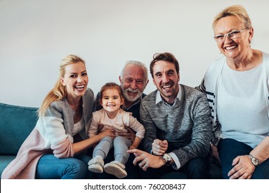 Portrait Of A Three Generation Family Spending Time Together