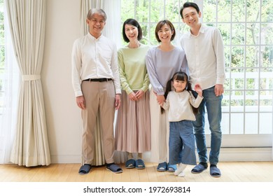 Portrait Of Three Generations Family In The Living Room