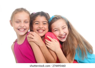 portrait of three happy girls on a white background