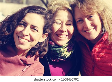 Portrait of three mature beautiful women outside