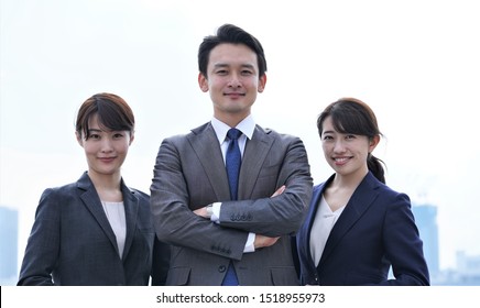 Portrait Of Three People Wearing Japanese Suits