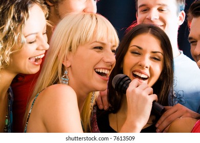 Portrait Of Three Young Attractive Women Singing Together