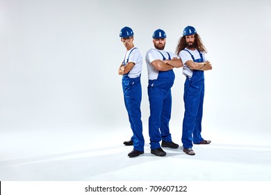 Portrait Of Three Young Craftsmen Ready To Work