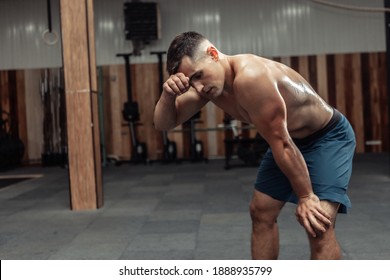 Portrait of tired male athlete after heavy intense workout in gym - Powered by Shutterstock