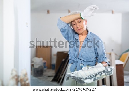 Similar – Image, Stock Photo Elderly woman painter holding a brush in art studio