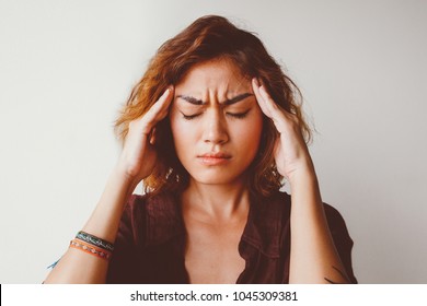 Portrait Of Tired Young Asian Woman Wearing Shirt Having Headache Touching Her Head. Annoyance And Stress Concept