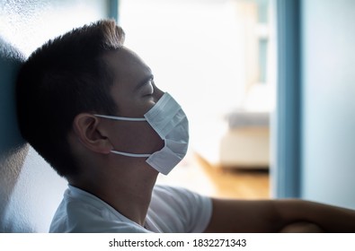 Portrait of tired young man wearing face mask. People dealing with coronavirus mental issues  - Shutterstock ID 1832271343