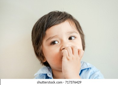 Portrait Of Toddler Boy Biting His Finger Nails While Looking At Camera In Retro Tone, Childhood And Family Concept, Emotional Child Portrait,