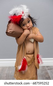 Portrait Of A Toddler Boy Holding A Turkey Leg For Thanksgiving.