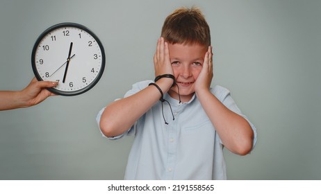 Portrait Of Toddler Kid Boy With Anxiety Checking Time On Clock, Running Late To Work, Being In Delay, Deadline. Young Teenager Child Schoolboy Looking At Hour, Minutes, Worrying To Be Punctual