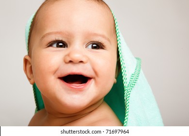 Portrait of a toothless baby laughing