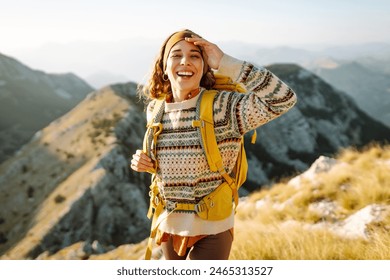 Portrait of a tourist on the mountain and enjoying freedom. Adventures. Active life. Lifestyle, travel, weekend. - Powered by Shutterstock