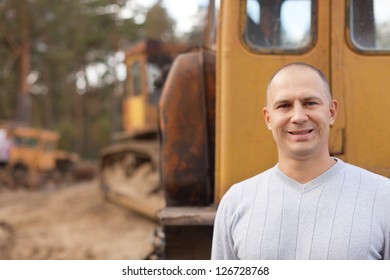 Portrait of tractor operator at workplace