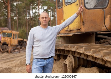 Portrait of tractor operator at workplace