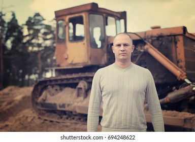 Portrait of tractor operator at workplace