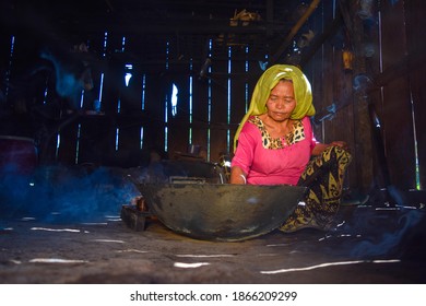 Portrait Of Traditional Palm Sugar Making In A Smoky Kitchen, East Java 2 December 2020