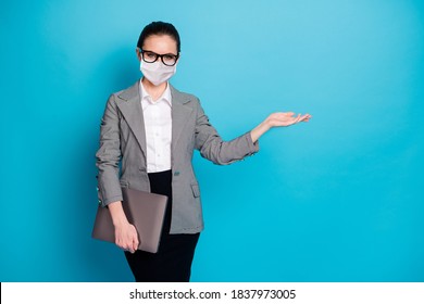 Portrait Of Trendy Girl Employee Carrying Laptop Holding On Palm Copy Space Advert Wear Mask Isolated Blue Color Background