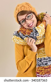 Portrait Of Trendy Girl With Eyeglasses And Winter Accessories