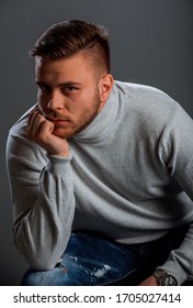 Portrait Of A Trendy Handsome Guy Wearing White Polo Neck Jumper