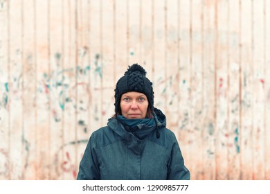 Portrait Of Troubled Uptight Woman On The Street On Cold Winter Day Looking At Camera