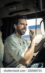 Portrait of a truck driver using CB radio
