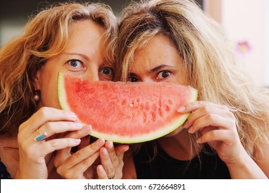 Portrait Of Two 40 Years Old Woman Eating Watermelon