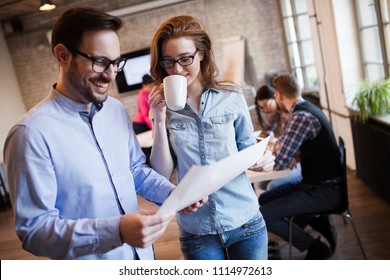 Portrait of two architects looking at project scheme