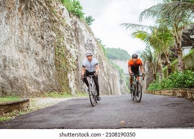 Portrait Of Two Asian Male Cyclist Friend Racing