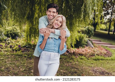 Portrait Of Two Attractive Cheerful Sweet Couple Hugging Enjoying Daydream Summertime On Fresh Air Outdoors