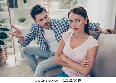 Portrait Of Two Attractive Sad People Married Spouses Husband Wife Breaking Up Having Big Fight In White Light Interior Room