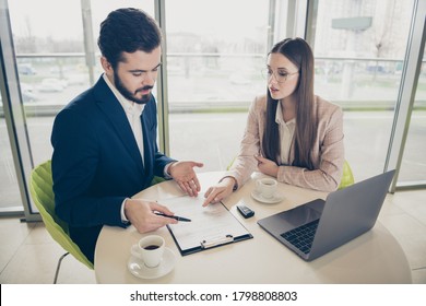 Portrait Of  Two Attractive Serious Stylish People Marketing Top Ceo Boss Chief Meeting Discussing Sales Plan Strategy Salary Income Drinking Espresso Light White Workplace Workstation