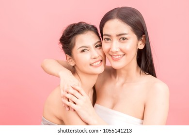 Portrait of two beautiful women beauty health care.beauty and spa.perfect fresh skin on pink background - Shutterstock ID 1055141213