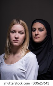 Portrait Of Two Beautiful Women Of Different Cultures